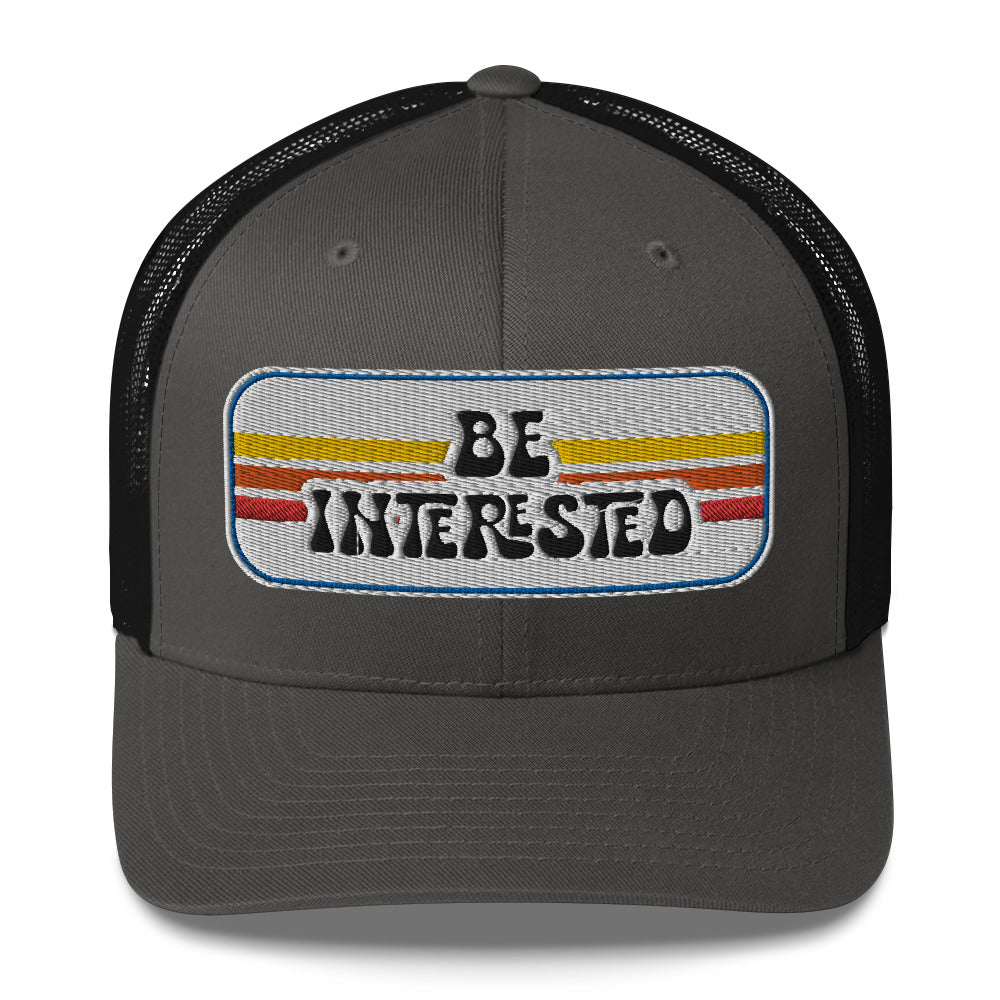 Be Interested Trucker Hat